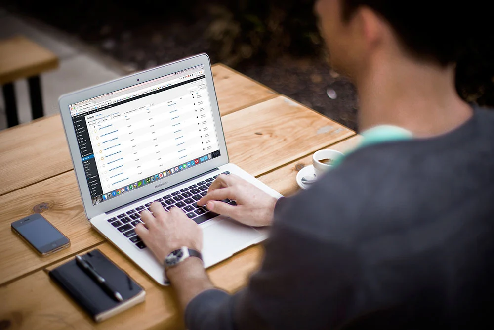 Illustration of a checklist clipboard surrounded by WordPress icons, gears, shield, and maintenance tools representing monthly website upkeep.